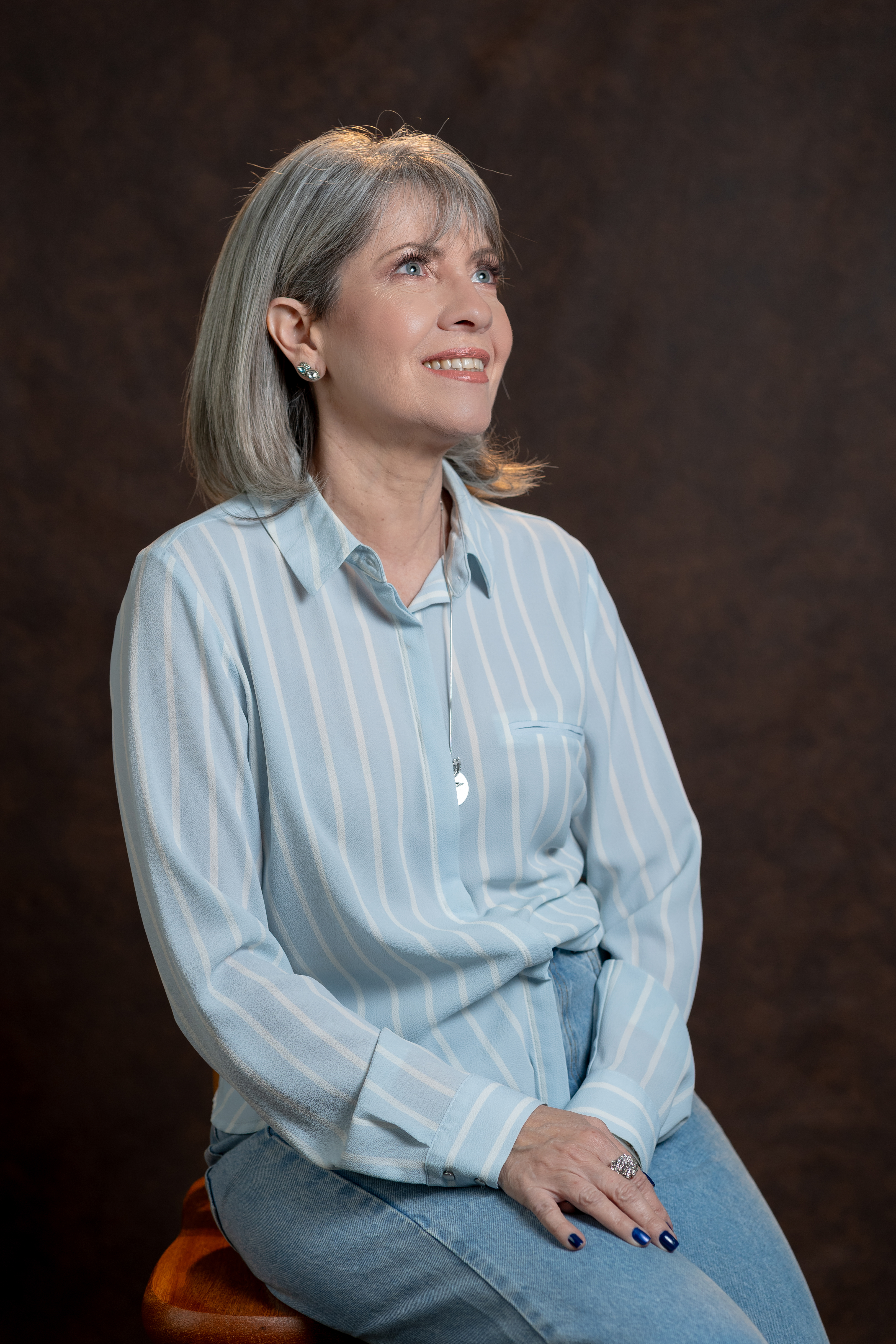 Professora universitária refletindo sobre sua transformação docente